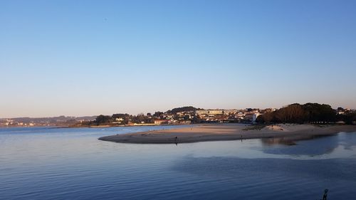 Scenic view of sea against clear blue sky