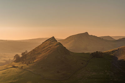 Scenic view of mountains against sky during sunset