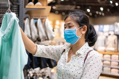 Portrait of woman standing in store