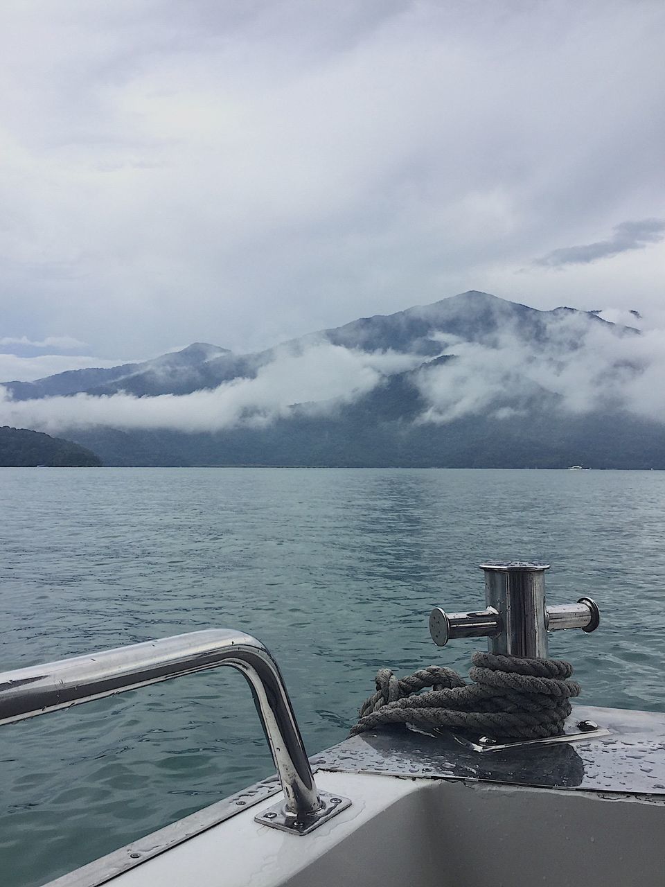 METALLIC STRUCTURE IN SEA AGAINST SKY