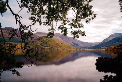 Scenic view of lake against sky at sunset