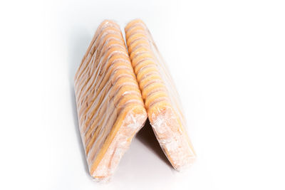 High angle view of bread against white background