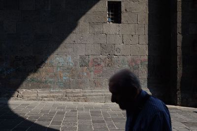 Full length of man shadow on wall