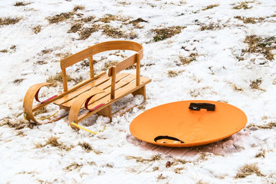 High angle view of empty seats on snow covered field