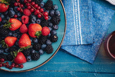 High angle view of strawberries in bowl on table