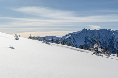 Scenic view of snowcapped mountains against sky
