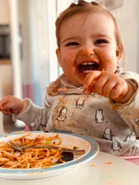 Portrait of boy eating food