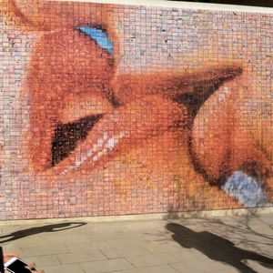 Close-up of graffiti on brick wall