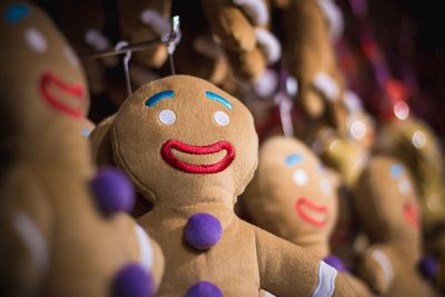 Close-up of toys hanging at market for sale