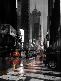 Cars on wet street in rainy season
