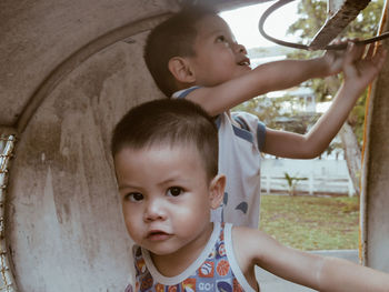 Portrait of cute boys looking up