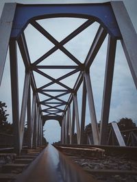 Bridge over road against sky