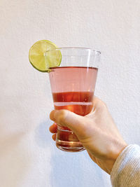 Midsection of man drinking glass