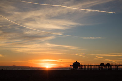 The huntington beach pier during sunset
