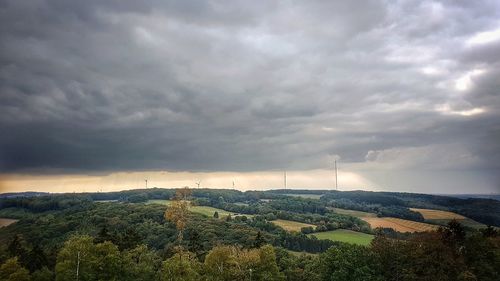 Scenic view of landscape against cloudy sky