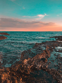 Scenic view of sea against sky during sunset