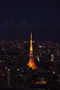 Tokyo tower lit up at night