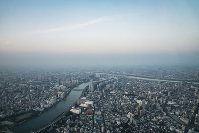 Aerial view of cityscape against sky