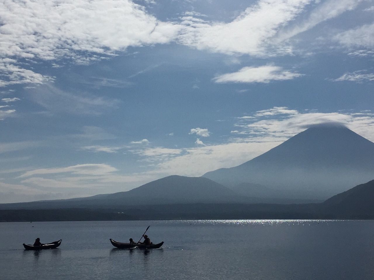 water, scenics, beauty in nature, mountain, nature, sky, sea, mountain range, nautical vessel, outdoors, tranquility, cloud - sky, day, no people