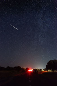 Scenic view of road against sky at night