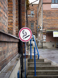 Road sign in front of building