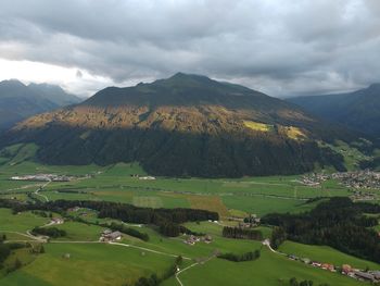 Scenic view of landscape and mountains against sky