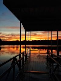 Scenic view of lake against orange sky