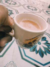 High angle view of coffee cup on table