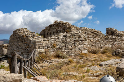 Old ruin building against cloudy sky