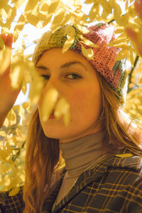 Portrait of young woman wearing hat