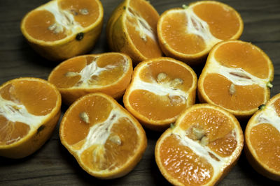 Close-up of halved oranges on table