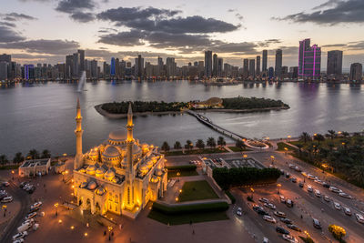 High angle view of illuminated buildings in city at night