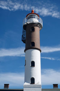 Low angle view of lighthouse against cloudy sky