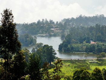 Scenic view of lake against cloudy sky