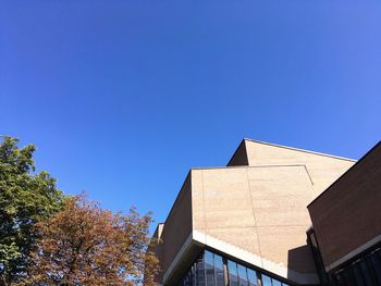 Low angle view of building against blue sky