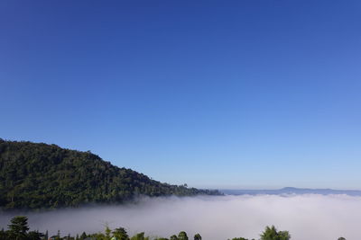 Scenic view of mountains against clear blue sky