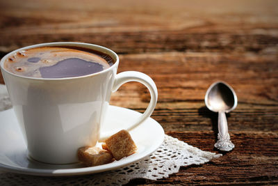 Close-up of coffee cup on table