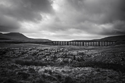 Ribblehead viaduct over landscape at yorkshire dales against cloudy sky