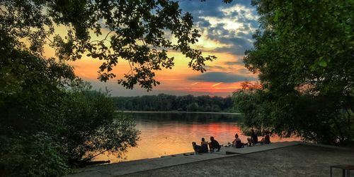 Scenic view of river against sky during sunset