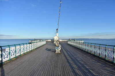 Pier over sea against sky