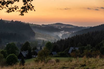 Scenic view of landscape against sky during sunset