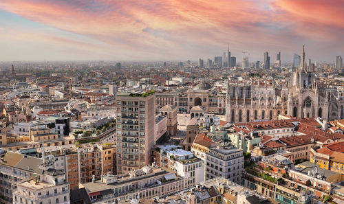 High angle view of city against sky during sunset