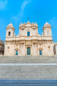 Low angle view of building against blue sky