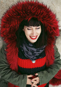 Smiling woman wearing jacket in winter