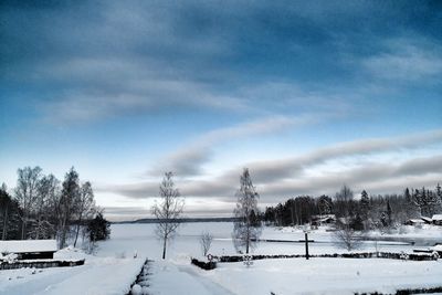 Scenic view of frozen landscape against sky