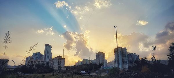 Panoramic view of buildings against sky during sunset