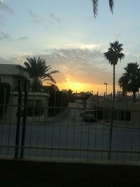 Fence against sky at sunset