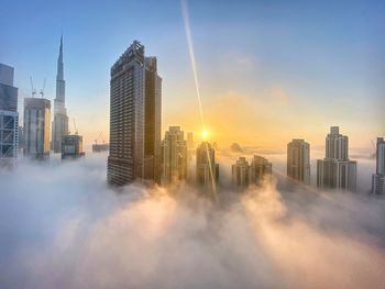 Panoramic view of buildings against sky during sunset