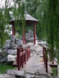 Gazebo on rock against trees