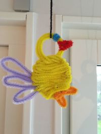 Close-up of stuffed toy hanging at home